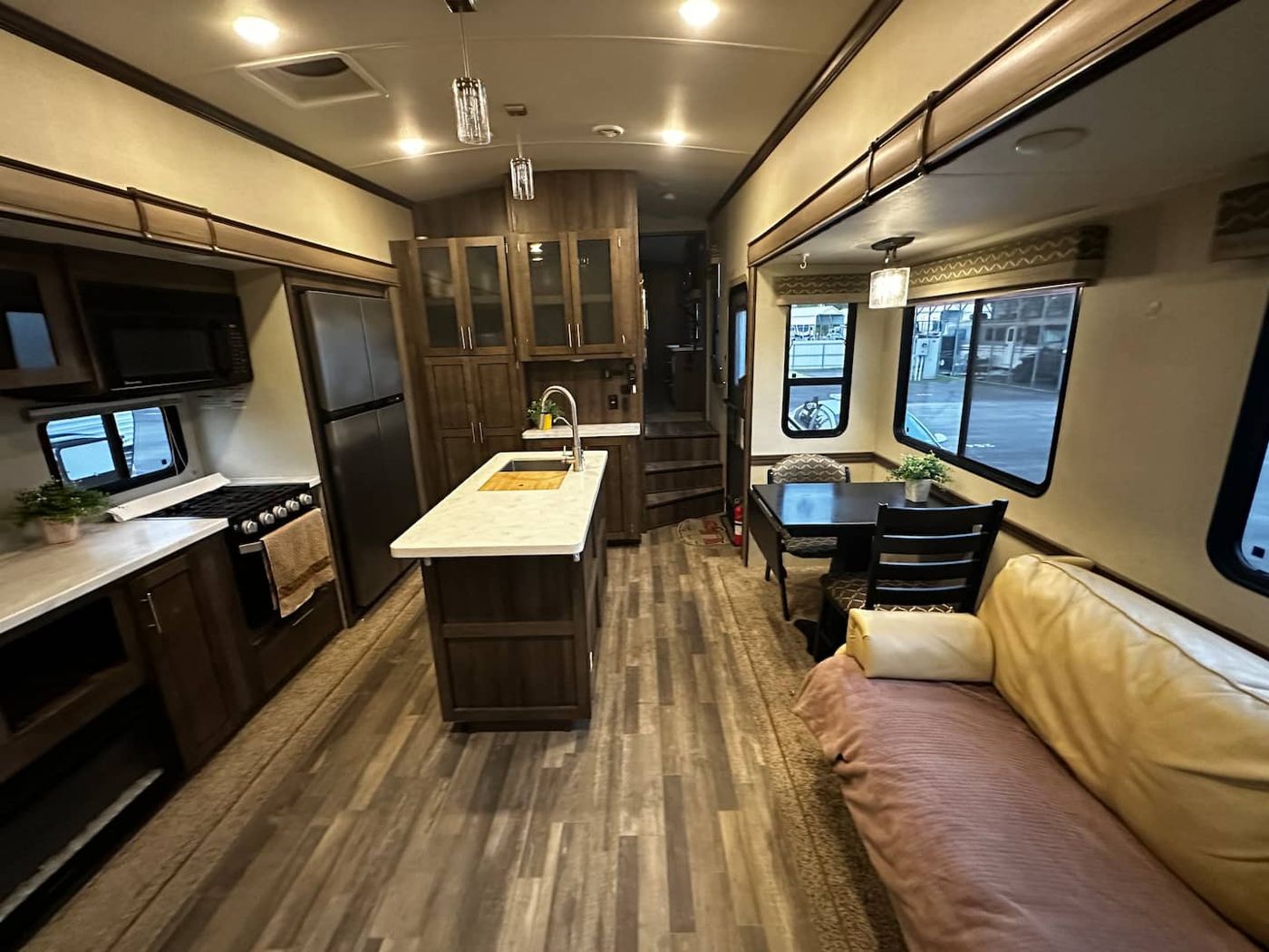 Inside the RV: the kitchen island, cabinets, and couch
